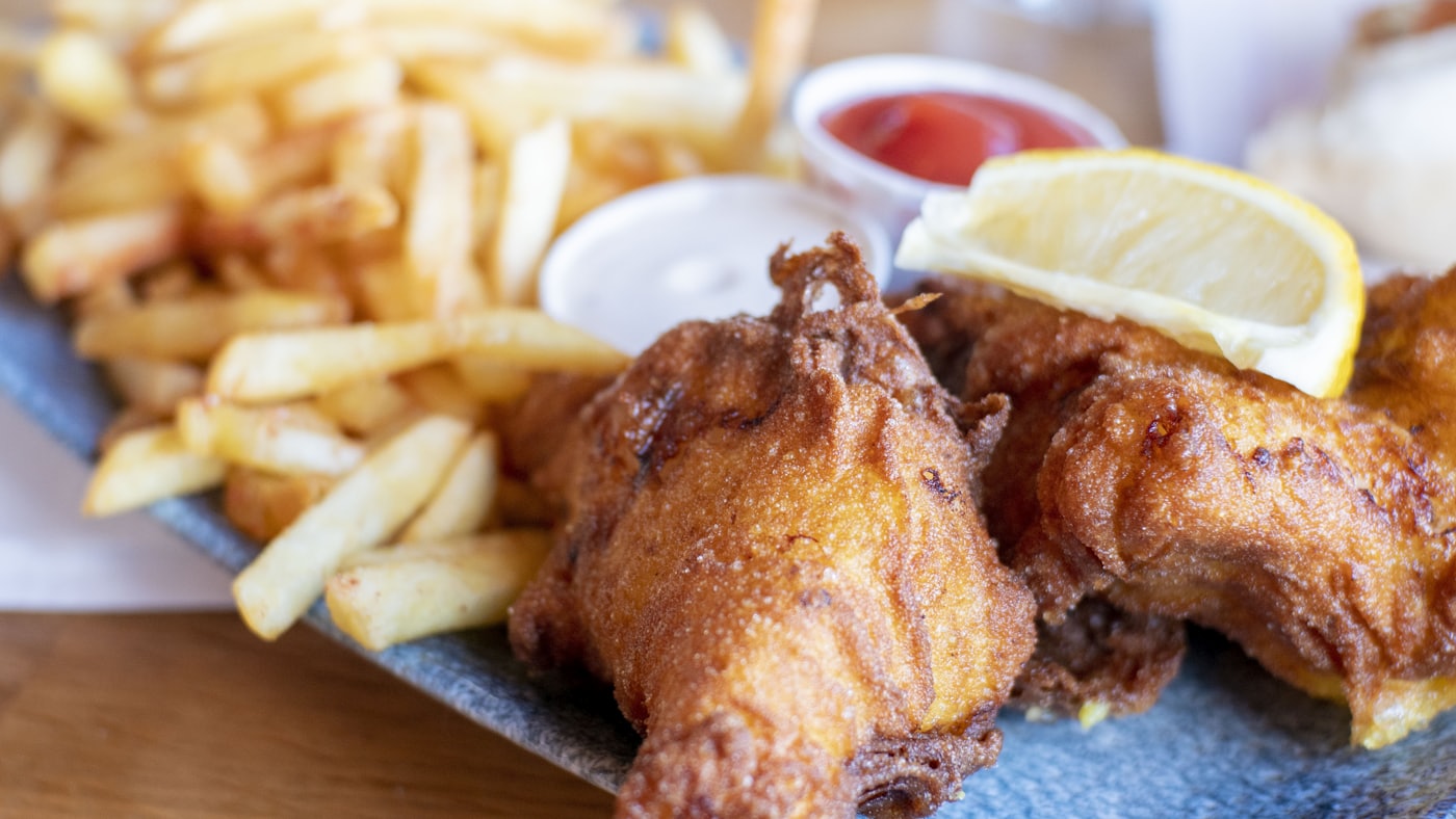 Golden battered fish and chips with lemon and tartar sauce — placeholder photo, not the Axe & Anchor’s kitchen
